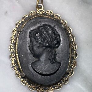 Black Paste Glass Cameo Left Facing Bronze Color Filigree Border